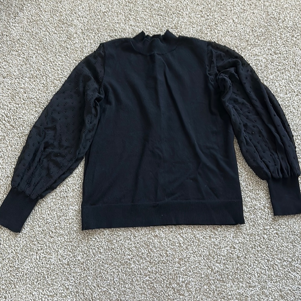 Women’s sweater with sheer sleeves